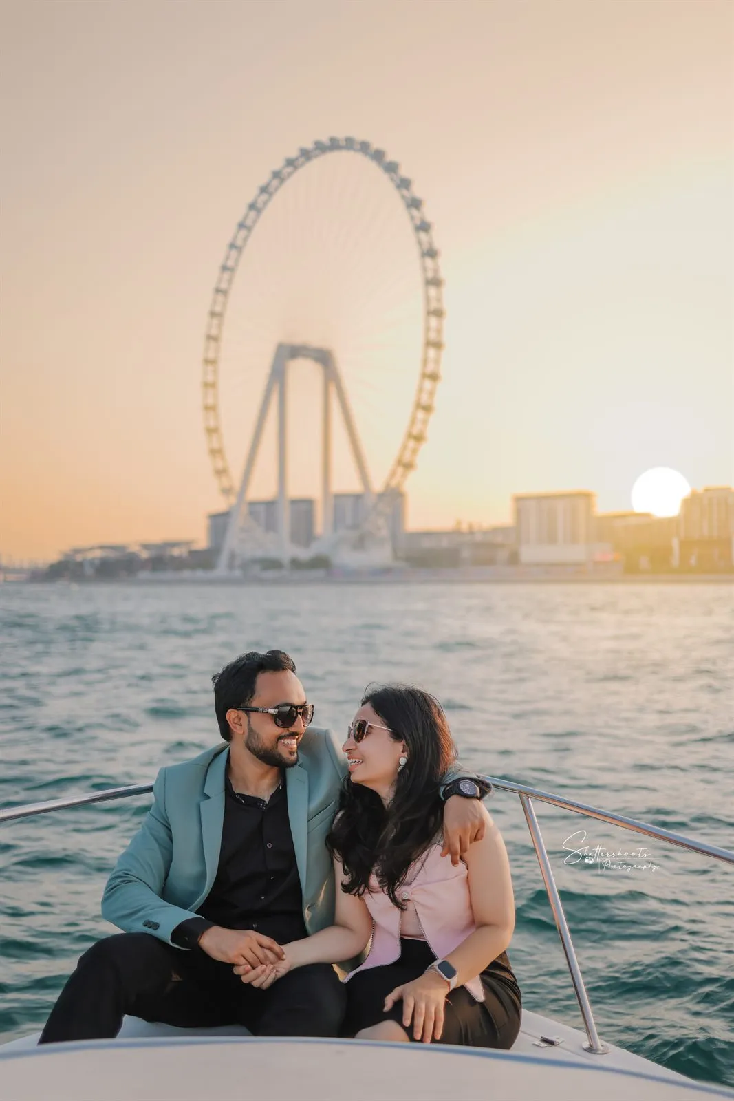 Couple on a boat at sunset in Dubai