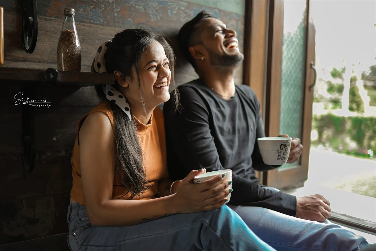 Couple by a window with coffee